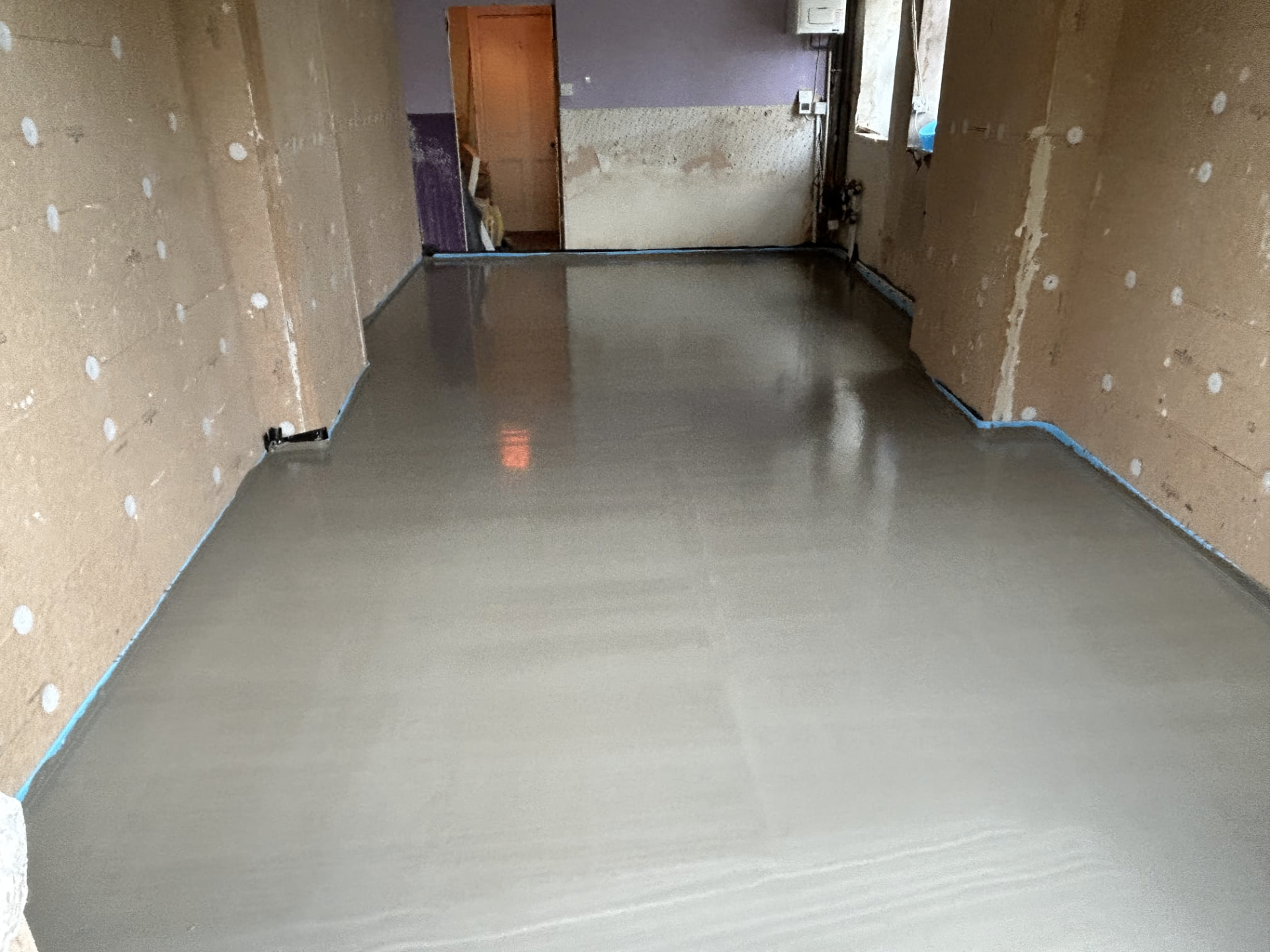 Long room completed with liquid screed ready for next stage