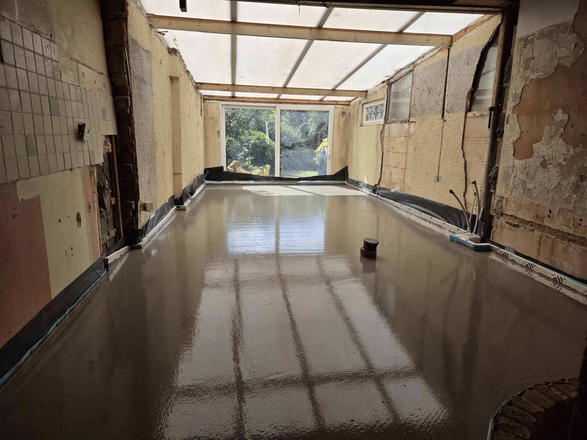 Large liquid screed installation reflecting natural light